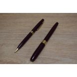 A Sheaffer Imperial IV Touchdown plunger fill fountain pen and propelling pencil set in burgundy