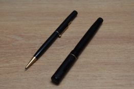 A Mabie Todd & Co Swan L205/60 twist fill fountain and propelling pencil set in black chaised with