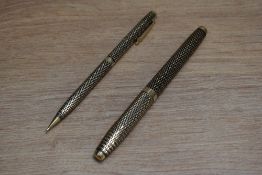 A Sheaffer Imperial Sovereign aerometric fill fountain pen and propelling pencil set in gold fill