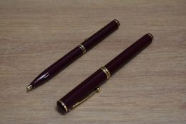 A Sheaffer Connoisseur aerometric fill fountain pen and ballpoint set in burgundy, the fountain