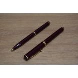 A Sheaffer Connoisseur aerometric fill fountain pen and ballpoint set in burgundy, the fountain