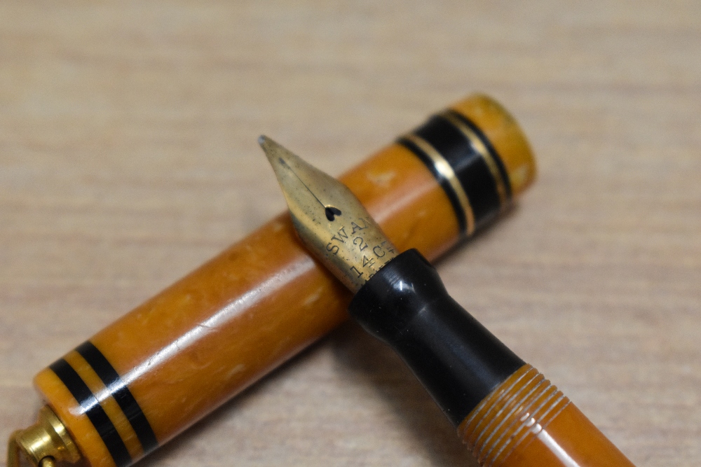 A Mabie Todd Swan 172/51 Self Filling lever fill fountain pen in tangerine with two narrow gold - Image 2 of 3