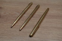 A Parker 50 Falcon Signet aero fill fountain pen, ballpoint pen and propelling pencil in gold