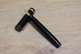A Parker Duofold Junior button fill fountain pen in black with single band to the cap having