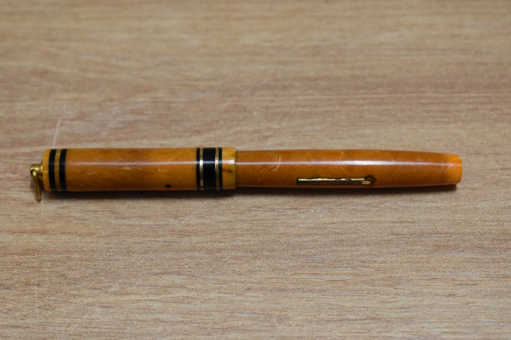 A Mabie Todd Swan 172/51 Self Filling lever fill fountain pen in tangerine with two narrow gold - Image 3 of 3