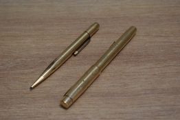 A De La Rue Onoto the Pen lever fill fountain pen and propelling pencil set in gold, the pen