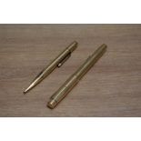 A De La Rue Onoto the Pen lever fill fountain pen and propelling pencil set in gold, the pen