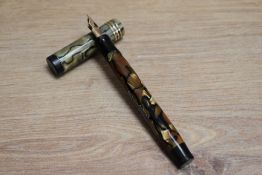 A Parker Duofold De Luxe Senior Lucky Curve button fill fountain pen in pearl and black with three