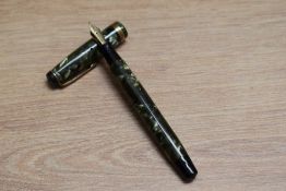 A Parker Televisor Junior button fill fountain pen in green marble with broad band to the cap having