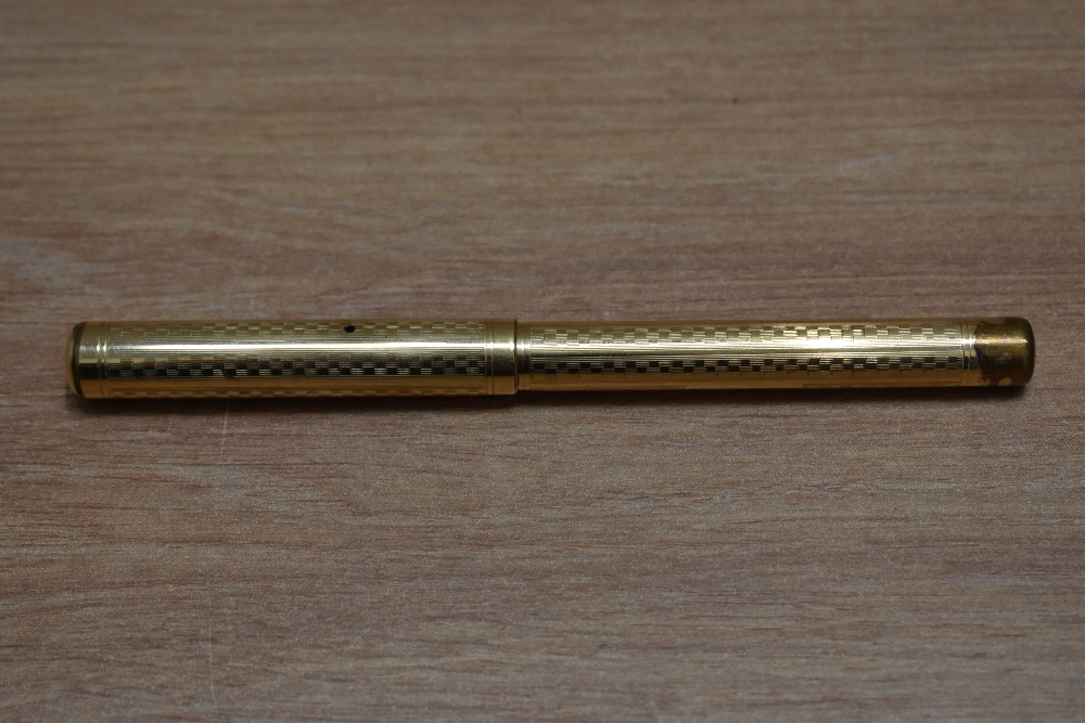 A Mabie Todd Self Filling lever fill fountain pen in yellow metal in engine turned chequered - Image 3 of 3