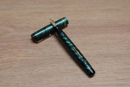 A Mabie Todd & Co Swan Ladies lever fill fountain pen in green snake skin design with two narrow