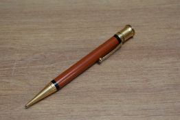 An early Parker Duofold oversize propelling pencil in orange