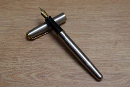 A Parker Sonnet Flighter GT converter fill fountain pen in stainless steel with gold trim having