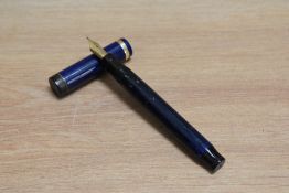 A Parker Duofold Senior Lucky Curve button fill fountain pen in lapis lazuli blue with white