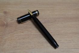 A Parker Duofold Senior Lucky Curve button fill fountain pen in black with two narrow bands to the