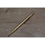 A Mabie Todd & Co Fyne Poynt propelling pencil in yellow metal.