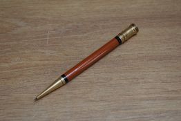 An early Parker Duofold ring top propelling pencil in orange