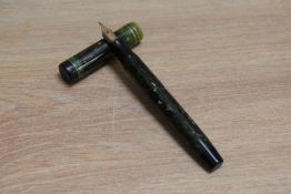 A Parker Duofold Junior Lucky Curve button fill fountain pen in mandarin yellow with two narrow
