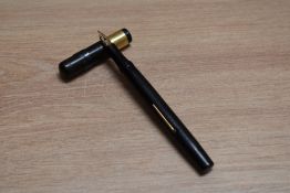 A Mabie Todd & Co Swan SF2 lever fill fountain pen in black hard rubber with broad gold band to