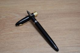 A Sheaffer Statesman snorkel fill fountain pen in black with broad band to white spot cap having