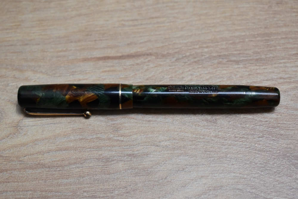 A Mabie Todd & Co 205/63 self-filler lever fill fountain pen russet and jade with narrow band to the - Image 3 of 3