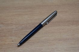 A Parker ballpoint pen in blue with stainless steel cap