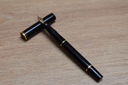 A Mabie Todd & Co Swan SF130C lever fill fountain pen in black with narrow bands to the top and