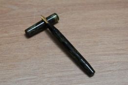 A Mabie Todd & Co Swan Visofil fountain pen in green black marble with two narrow bands to the cap