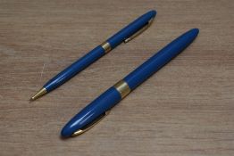 A Sheaffer Statesman snorkel fill fountain pen and propelling pencil set in aqua blue with white