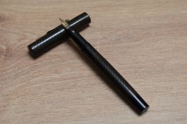 A Mabie Todd & Co Swan 'Posting' eye dropper fountain pen in chaised black hard rubber having Singer