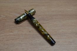 A Mabie Todd & Co Swan leverless twist fill fountain pen in green pearl with two narrow bands to the