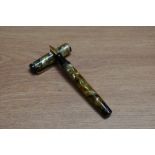 A Mabie Todd & Co Swan leverless twist fill fountain pen in green pearl with two narrow bands to the