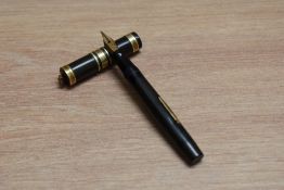 A Mabie Todd & Co Swan 192/34 lever fill fountain pen in black with broad decorative band and two