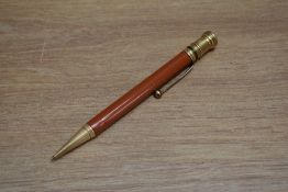 A Parker Duofold Junior propelling pencil in orange