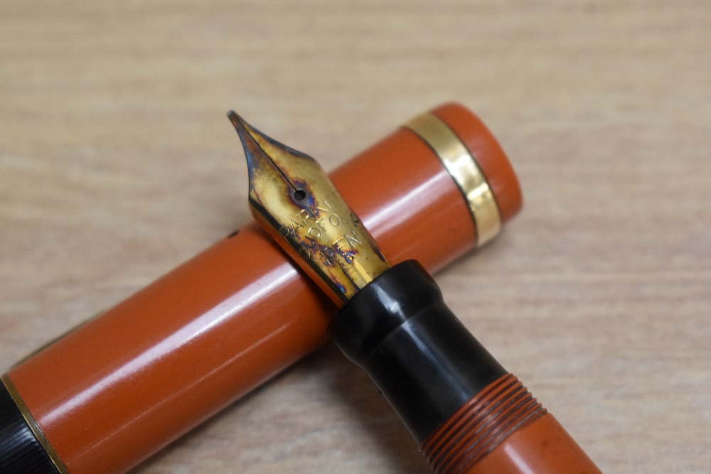 A Parker Duofold Lucky Curve Senior button fill fountain pen in orange with raised band to the cap - Image 2 of 3