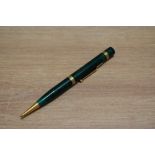A Mabie Todd Fyne Poynt propelling pencil in dark jade green with two ribbed rings