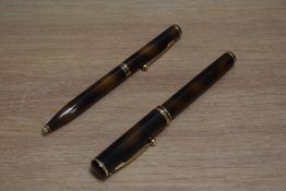 A Sheaffer Connoisseur aerometric fill fountain pen and ballpoint set in tortoise shell, the