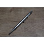 A Mabie Todd & Co Fyne Poynt silver coloured propelling pencil.