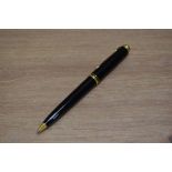 A Pelikan ballpoint pen in black