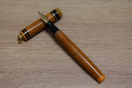 A Mabie Todd Swan 172/51 Self Filling lever fill fountain pen in tangerine with two narrow gold