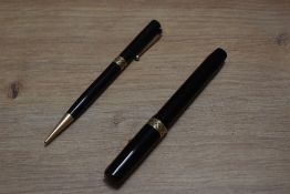 A Mabie Todd & Co Swan Visofil fountain pen and Fyne Poynt propelling pencil in black with pierced