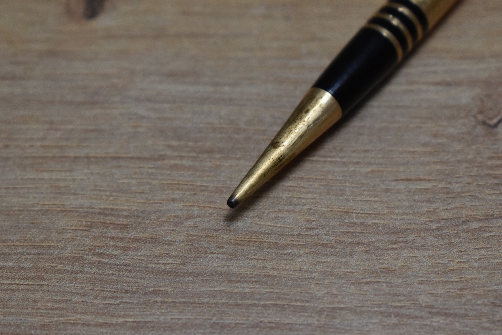 A Mabie Todd & Co Fyne Poynt propelling pencil set in black with gold overlay and several decorative - Image 2 of 2