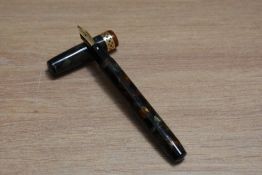 A Mabie Todd & Co Swan Visofil fountain pen in russet and jade with broad pierced band to the cap