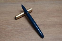 A Parker 51 aero fill fountain pen in teal blue with rolled gold cap