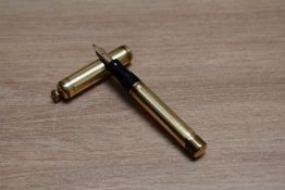 A Mabie Todd & Co Swan lever fill fountain pen in reeded gold with ring top cap having Mabie