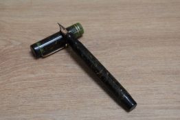 A Parker Duofold Senior Lucky Curve button fill fountain pen in jade green with two narrow bands