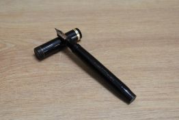 A Parker Duofold Senior button fill fountain pen in black with single band to the cap having