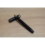 A Parker Duofold Senior button fill fountain pen in black with single band to the cap having