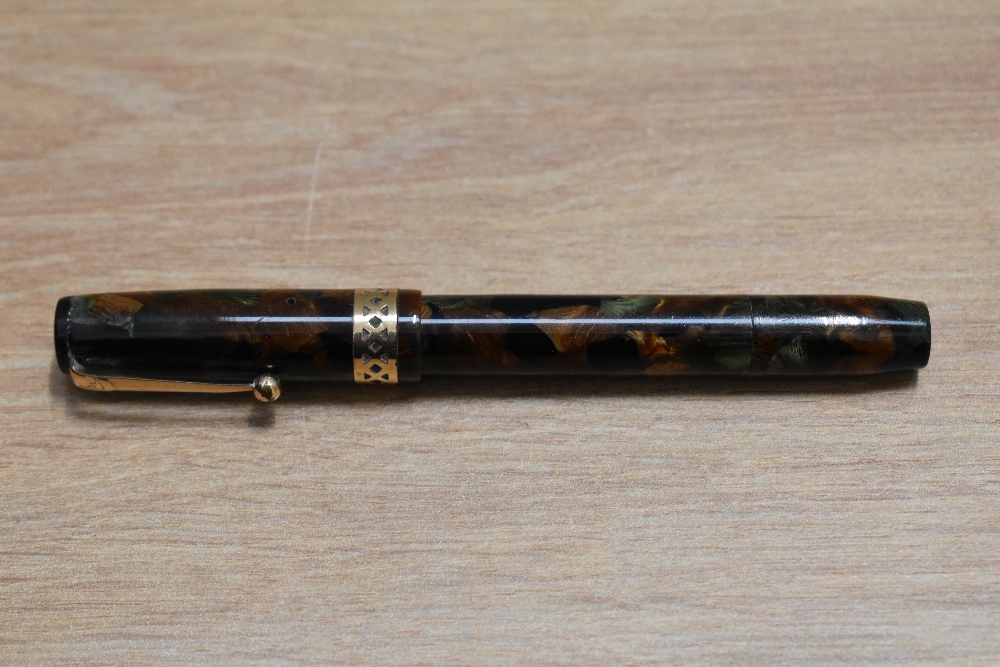 A Mabie Todd & Co Swan Visofil fountain pen in russet and jade with broad pierced band to the cap - Image 3 of 3