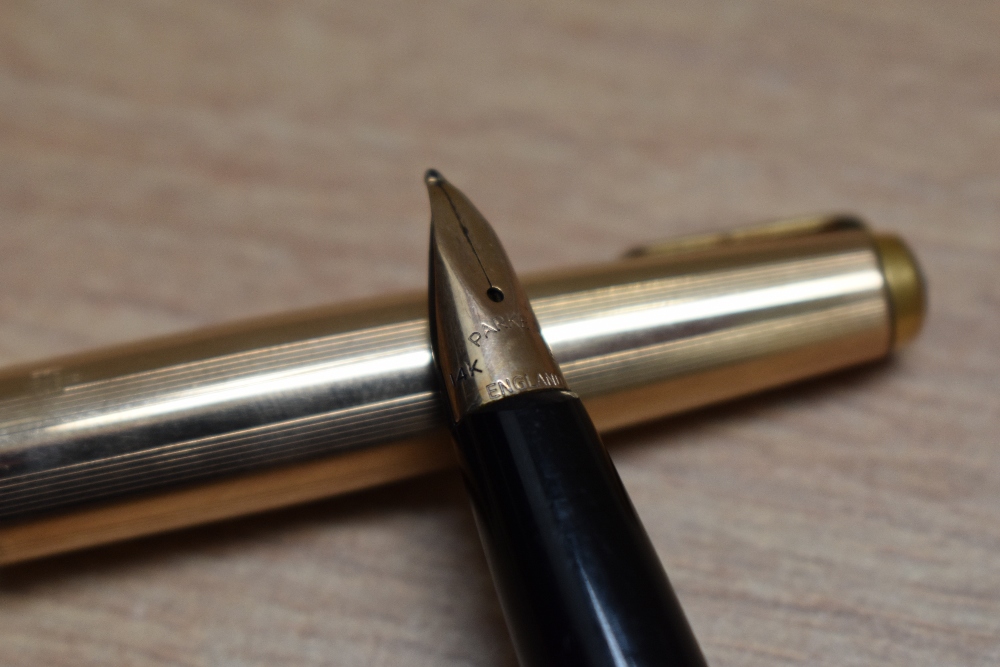 A Parker 65 aero fill fountain pen in rolled gold having Parker 14k nib. Engraved and dent to - Image 2 of 3